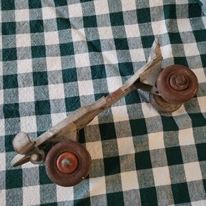 Vintage Metal Roller Skate with Rusty Wheels